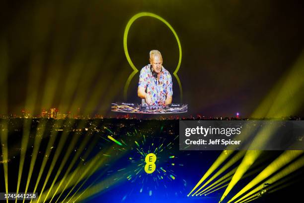 Fatboy Slim and virtual backing dancers from across the UK light up the sky above Alexandra Palace, to form the world's biggest holographic...