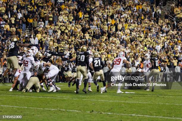 Joshua Karty of the Stanford Cardinal kicks a game winning 31 yard field goal in the second overtime during a game between Stanford University and...