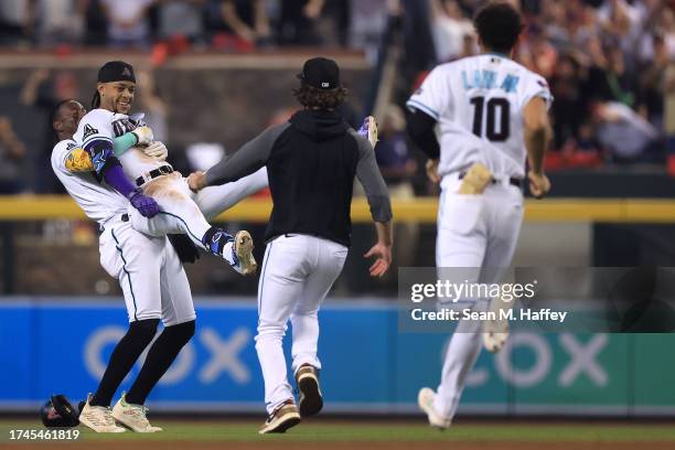 Ketel Marte of the Arizona Diamondbacks celebrates with his teammates after hitting an RBI single against Craig Kimbrel of the Philadelphia Phillies...