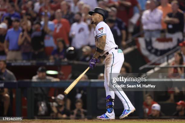 Ketel Marte of the Arizona Diamondbacks hits an RBI single against Craig Kimbrel of the Philadelphia Phillies to win Game Three of the National...