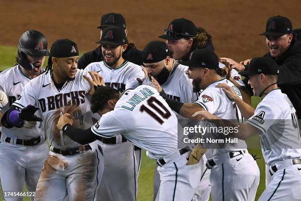 Ketel Marte of the Arizona Diamondbacks celebrates with his teammates after hitting an RBI single against Craig Kimbrel of the Philadelphia Phillies...