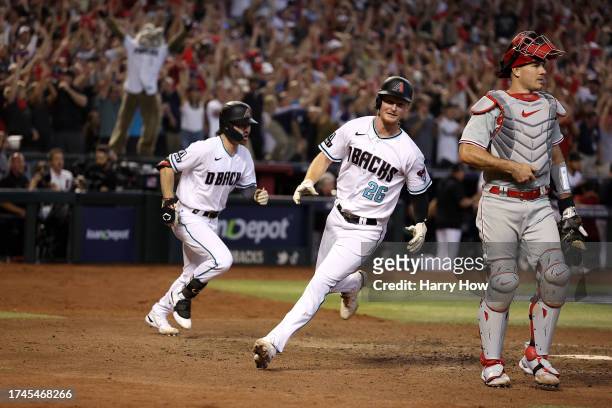 Corbin Carroll and Pavin Smith of the Arizona Diamondbacks celebrate after defeating the Philadelphia Phillies in Game Three of the National League...