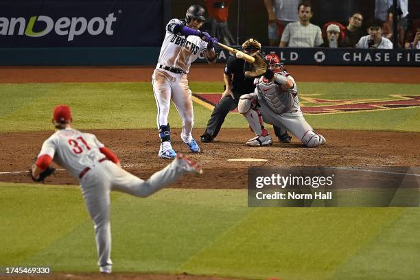 Ketel Marte of the Arizona Diamondbacks hits an RBI single against Craig Kimbrel of the Philadelphia Phillies to win Game Three of the National...