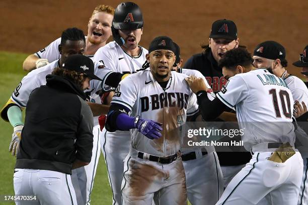 Ketel Marte of the Arizona Diamondbacks celebrates with his teammates after hitting an RBI single against Craig Kimbrel of the Philadelphia Phillies...