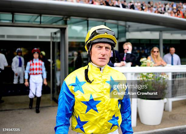 Jockey Johnny Murtagh poses at Ascot racecourse on July 27, 2013 in Ascot, England.