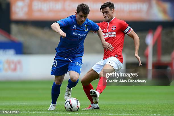 Aaron Doran of Inverness and Johnnie Jackson of Charlton contest the ball during the Pre Season Friendly match between Charlton Athletic and...