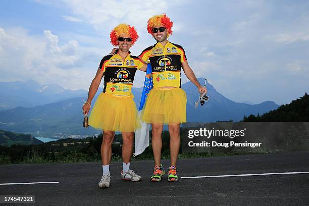 Fans in costume pose for a photo on the course during stage seventeen of the 2013 Tour de France, a 32KM Individual Time Trial from Embrun to...