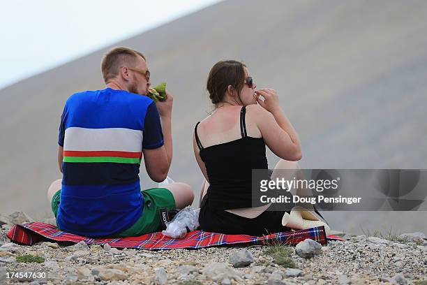 Fans have a picnic as they await the race on Mont Ventoux during stage fifteen of the 2013 Tour de France, a 242.5KM road stage from Givors to Mont...