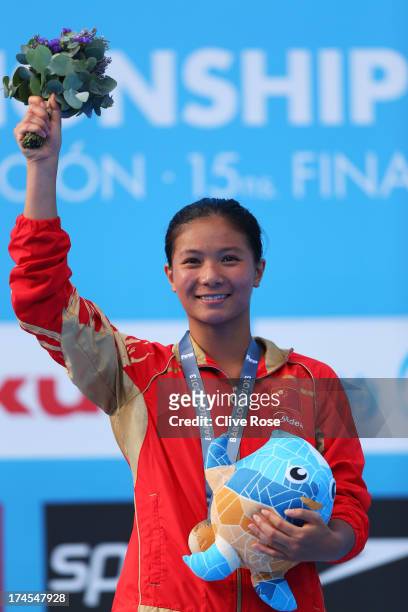 Gold medal winner Zi He of China celebrates after the Women's 3m Springboard Diving Semifinal round on day eight of the 15th FINA World Championships...