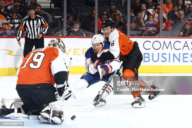 Mattias Janmark of the Edmonton Oilers and Travis Sanheim of the Philadelphia Flyers challenge for the puck during the first period at the Wells...