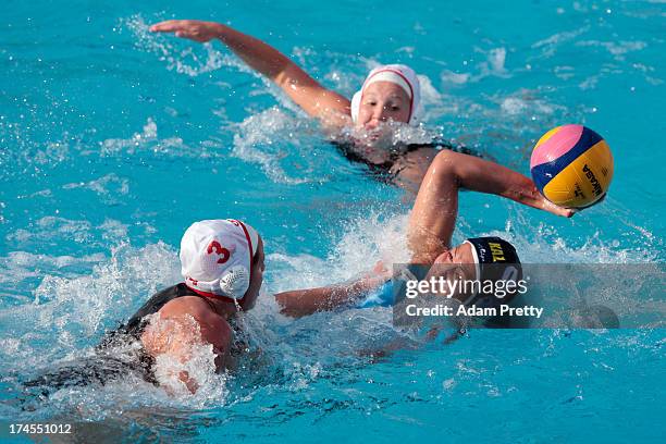 Katrina Monton of Canada tackles Assel Jakayeva of Kazakhstan during the Women's Water Polo quarter final qualification match between Canada and...