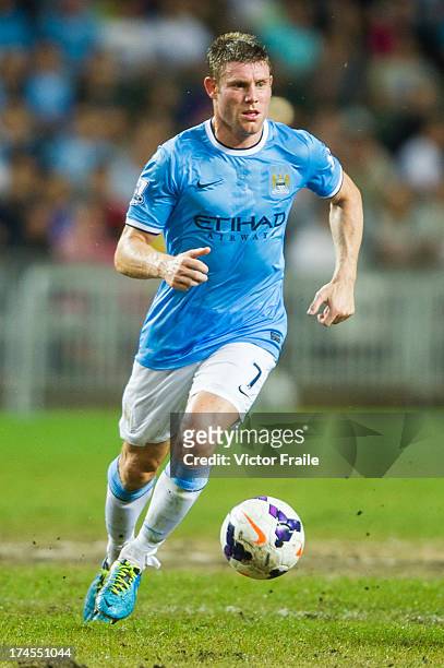 James Milner of Manchester City runs with the ball during the Barclays Asia Trophy Final match between Manchester City and Sunderland at Hong Kong...