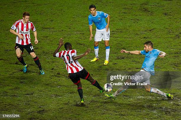 El-Hadji Ba of Sunderland and Javi Garcia of Manchester City fight for the ball during the Barclays Asia Trophy Final match between Manchester City...