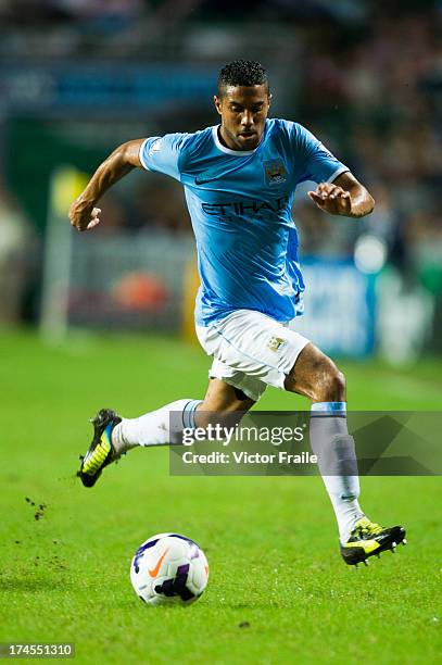 Gael Clichy of Manchester City runs with the ball during the Barclays Asia Trophy Final match between Manchester City and Sunderland at Hong Kong...
