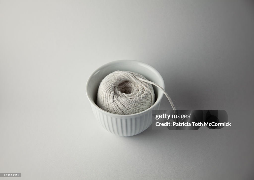 Ball of White Twine in White Bowl