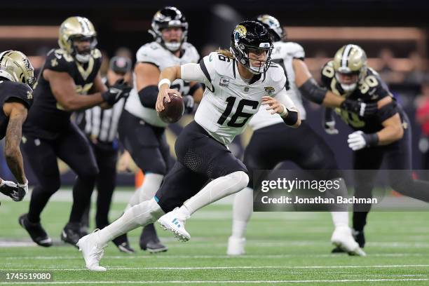 Trevor Lawrence of the Jacksonville Jaguars runs with the ball during the first half against the New Orleans Saints at Caesars Superdome on October...