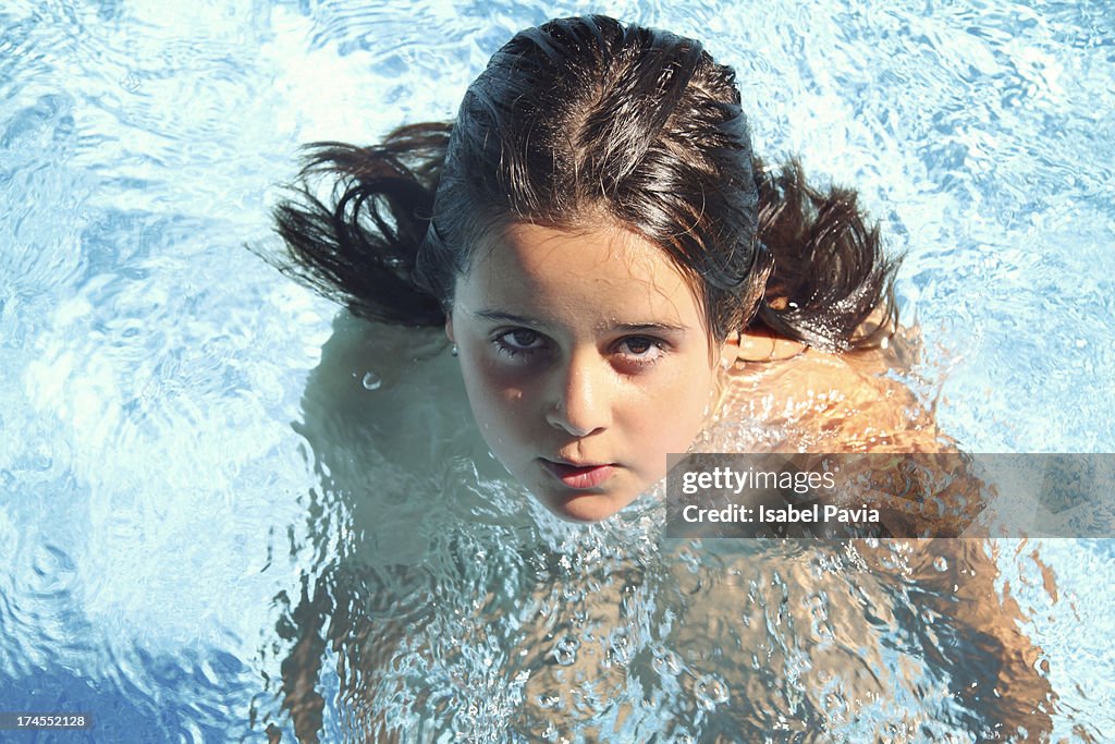 Pretty girl at swimming pool