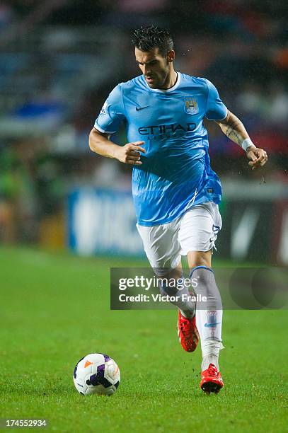 Alvaro Negredo of Manchester City runs with the ball during the Barclays Asia Trophy Final match between Manchester City and Sunderland at Hong Kong...