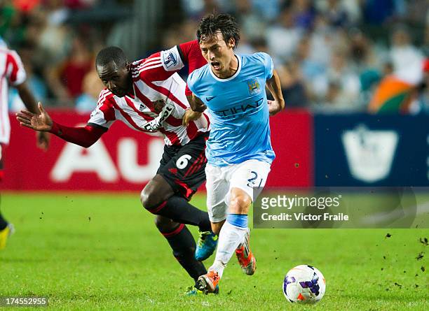David Silva of Manchester City and Cabral of Sunderland fight for the ball during the Barclays Asia Trophy Final match between Manchester City and...