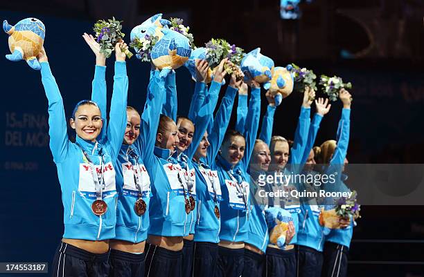 Bronze medal winners Ukraine celebrate after the Synchronized Swimming Free Combination Final on day eight of the 15th FINA World Championships at...