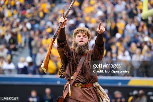 The West Virginia Mountaineers mascot The Mountaineer on the field during the second quarter of the college football game between the Oklahoma State...