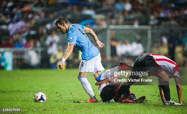 Alvaro Negredo of Machester City fights for the ball during the Barclays Asia Trophy Final match between Manchester City and Sunderland at Hong Kong...