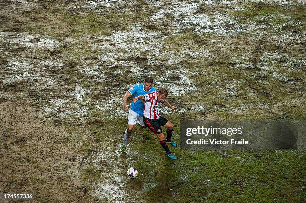 Javi Garcia of Manchester City and Sebastian Larsson of Sunderland battle for the ball during the Barclays Asia Trophy Final match between Manchester...