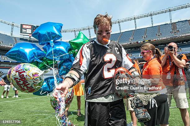 Brendan Mundorf of the Denver Outlaws is jokingly given balloons for his birthday after a win over the visiting Chesapeake Bayhawks after a Major...