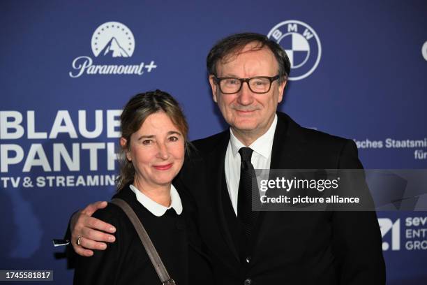 October 2023, Bavaria, Munich: Christina Scholz and actor Rainer Bock stand on the red carpet at BMW Welt during the presentation of the "Blue...