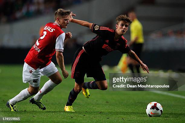 Mattias Johansson of AZ and Lucas Andersen of Ajax battle for the ball during the Johan Cruyff Shield match between AZ Alkmaar and Ajax Amsterdam at...