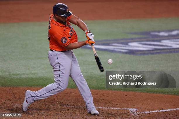 José Abreu of the Houston Astros hits a home run in the fourth inning against the Texas Rangers during Game Four of the Championship Series at Globe...