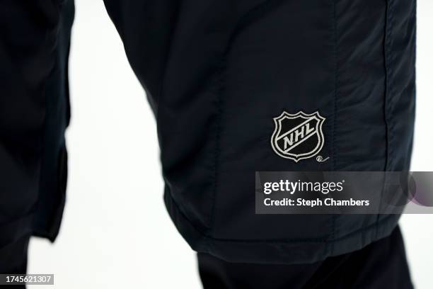 Detail of the NHL logo is seen before the game between the Seattle Kraken and the Carolina Hurricanes at Climate Pledge Arena on October 19, 2023 in...