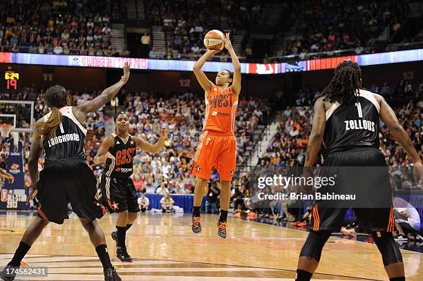 Kristi Toliver of the Western Conference All-Stars shoots against Crystal Langhorne of the Eastern Conference All-Stars during the 2013 Boost Mobile...