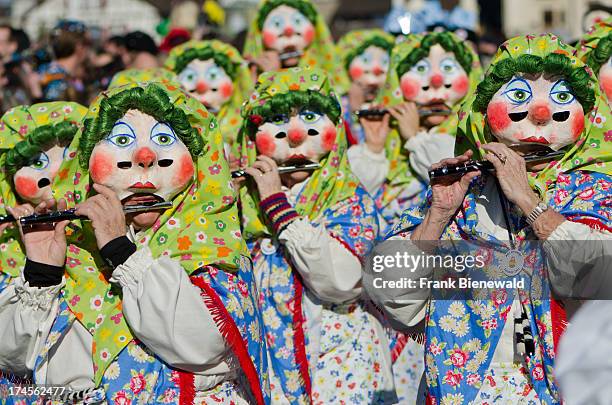 Hundred different groups of masked people walk through the streets of Basel for 3 days and nights at "Basler Fasnet", playing music all the time..