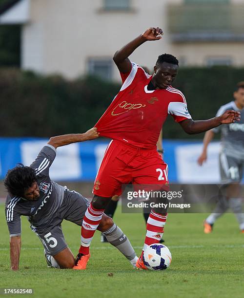 Ibrahim Toraman of Besiktas and Victor Wanyama of Southampton compete for the ball during the preseason friendly match between Southampton FC and...