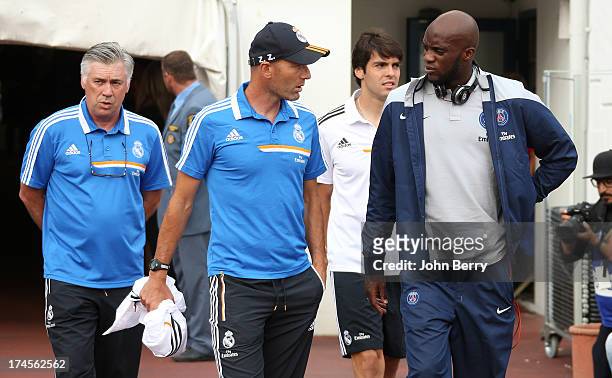 Carlo Ancelotti, coach of Real Madrid, his assistant-coach Zinedine Zidane, Mohamed Sissoko of PSG chat prior to the friendly match between Real...