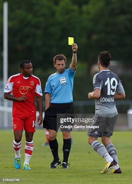 Gokhan Suzen of Besiktas is shown a yellow card during the preseason friendly match between Southampton FC and Besiktas Istanbul at Stadion Villach...