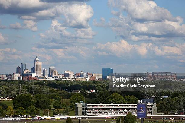 Cars race through turn two with the skyline of downtown Indianapolis during the NASCAR Nationwide Series Indiana 250 at Indianapolis Motor Speedway...