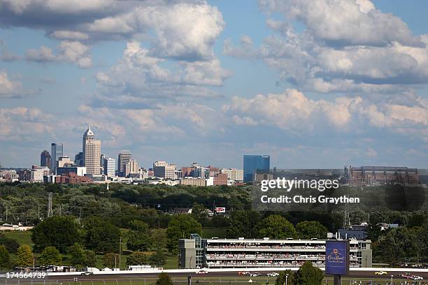Cars race through turn two with the skyline of downtown Indianapolis during the NASCAR Nationwide Series Indiana 250 at Indianapolis Motor Speedway...