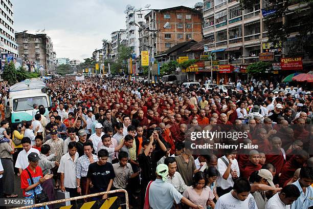 Over a hundred thousand Burmese people gathered in Rangoon streets to watch and encourage a 3-hour march led by thousands of Buddhist monks and...