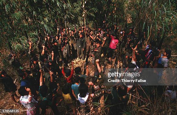 Gathering of God's Army soldiers around Johnny Htoo in Kamerplaw, southern Burma - headquarters of a ragtag breakaway faction of the Karen National...