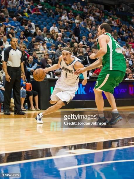 Alexey Shved of the Minnesota Timberwolves drives up court during the preseason game between the of the Minnesota Timberwolves and the Maccabi Haifa...