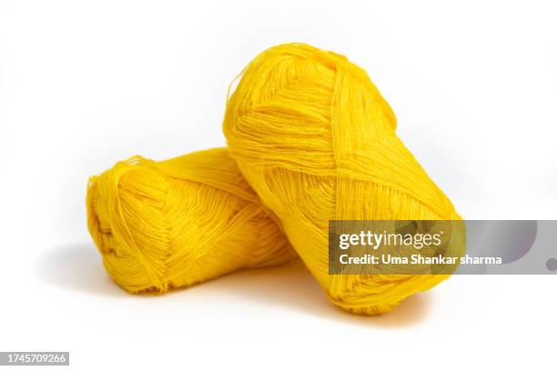 textile: yellow wool yarn on white background. - garnbündel stock-fotos und bilder