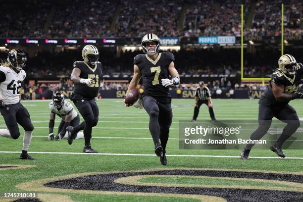 Taysom Hill of the New Orleans Saints scores a 1-yard rushing touchdown during the fourth quarter against the Jacksonville Jaguars at Caesars...