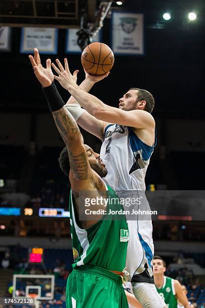 Kevin Love of the Minnesota Timberwolves shoots the ball against defense during the preseason game between the of the Minnesota Timberwolves and the...