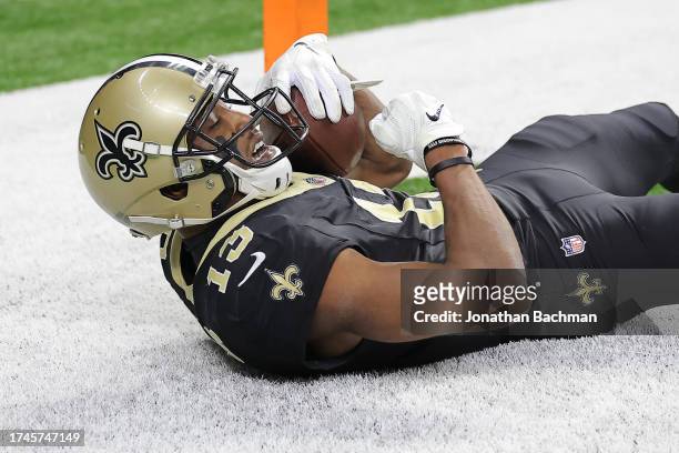 Michael Thomas of the New Orleans Saints celebrates after catching a 17-yard touchdown pass against Montaric Brown of the Jacksonville Jaguars during...