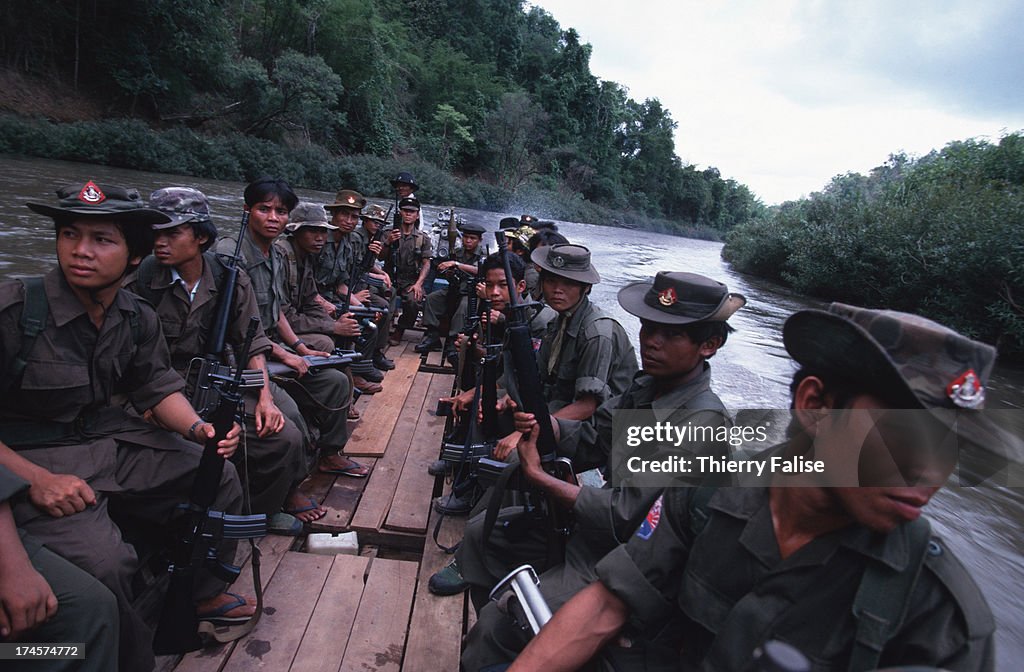 Karen National Union (KNU) soldiers on boat patrol on the...