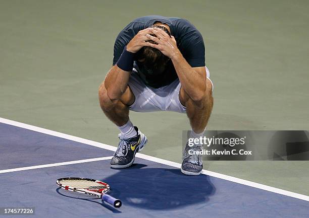 Ryan Harrison drops his racquet after a misplayed return to Kevin Anderson of South Africa during the BB&T Atlanta Open in Atlantic Station on July...