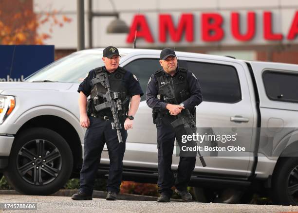 Lewiston, ME Heavily armed police stand at the ambulance entrance to the Central Maine Medical Center in Lewiston where many of the shooting victims...