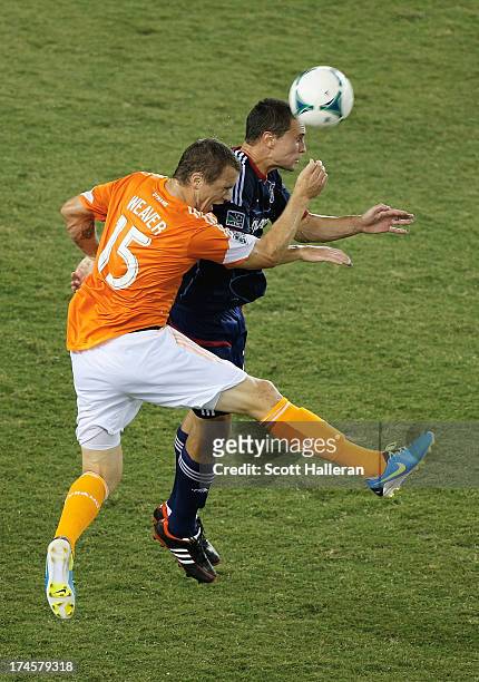 Cam Weaver of the Houston Dynamo works the ball against Austin Berry of the Chicago Fire at BBVA Compass Stadium on July 27, 2013 in Houston, Texas.